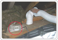 The existing bathroom fan venting humid air into loft